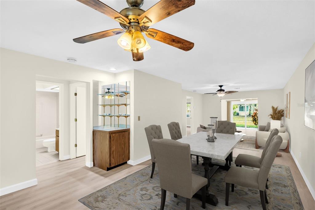 899 Cleland Court, Unit A Palm Harbor, FL 34684 - Photo 10 of 51 a view of a dining room with furniture and wooden floor