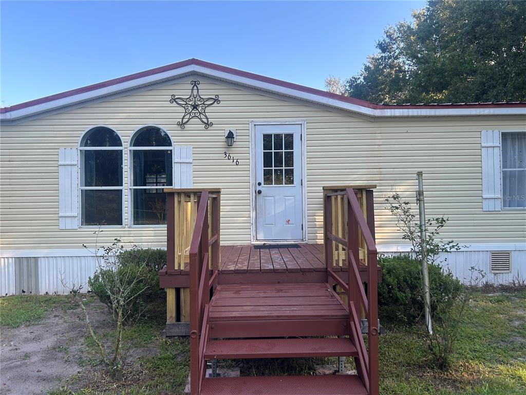 3616 Nichols Road Lithia, FL 33547 - Photo 1 of 1 a front view of a house with garden