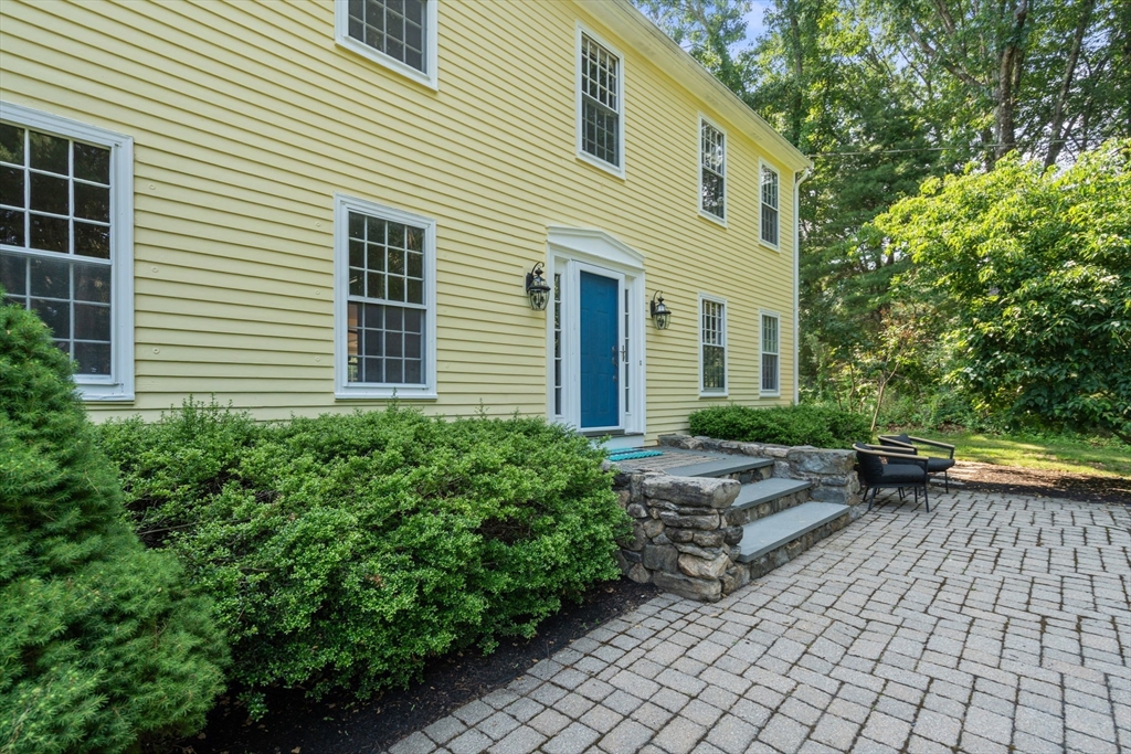 24 Russett Hill Road Sherborn, MA 01770 - Photo 2 of 39 a view of a house with backyard and sitting area