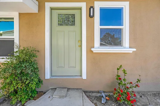 a front view of a house with a yard and a garage