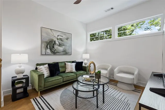 a living room with furniture and a window