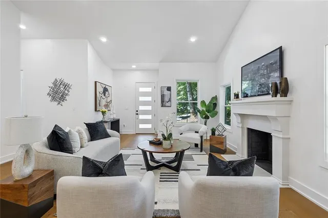 a living room with furniture and a fireplace