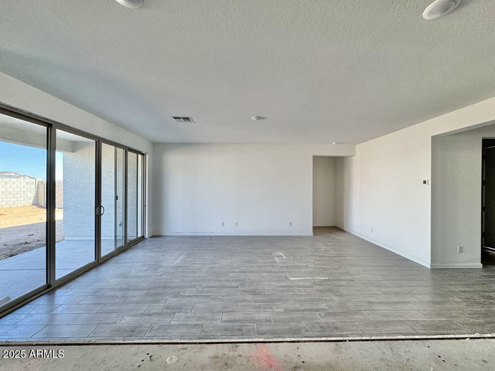 15714 West Brown Street Waddell, AZ 85355 - Photo 12 of 36 a view of a livingroom with wooden floor