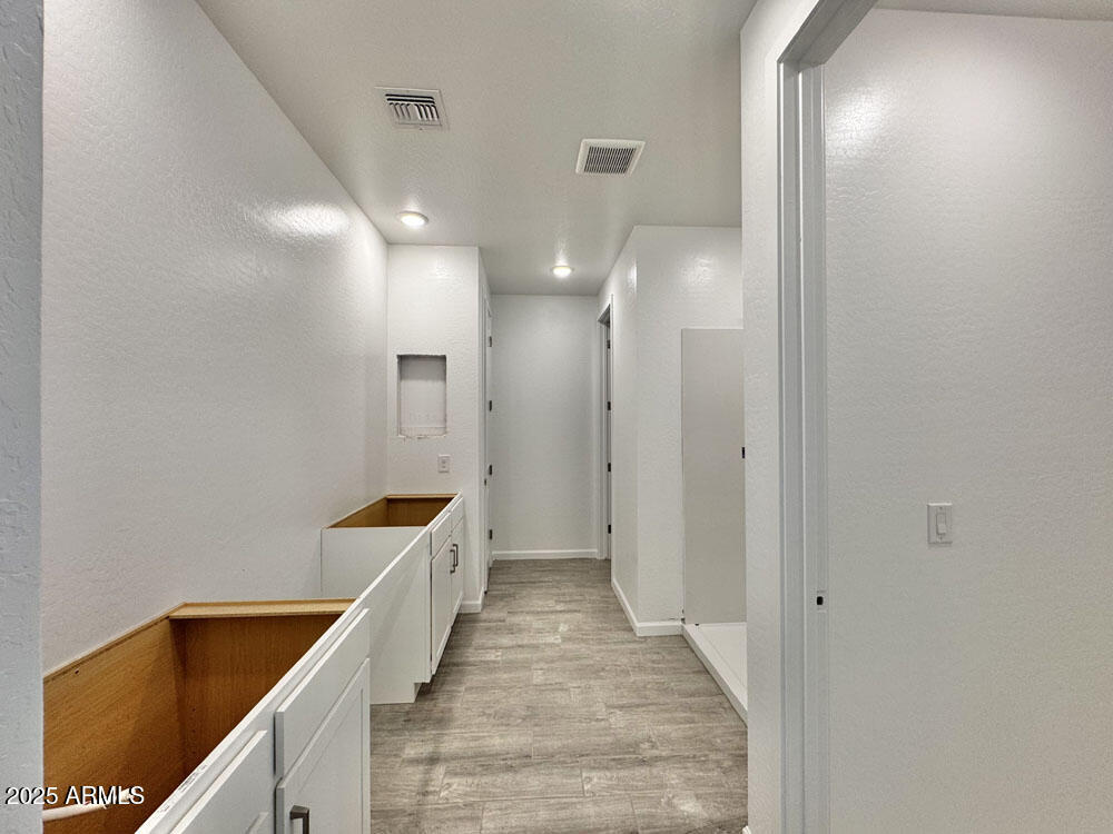 15714 West Brown Street Waddell, AZ 85355 - Photo 14 of 36 a bathroom with a bathtub and a sink
