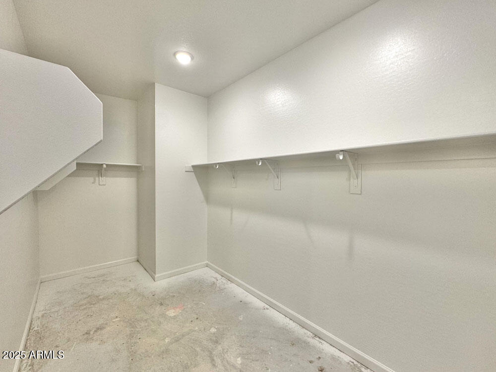 15714 West Brown Street Waddell, AZ 85355 - Photo 15 of 36 an empty room with a natural light