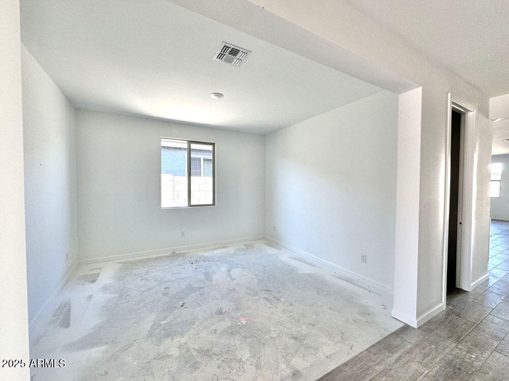 15714 West Brown Street Waddell, AZ 85355 - Photo 7 of 36 a view of an empty room with a window