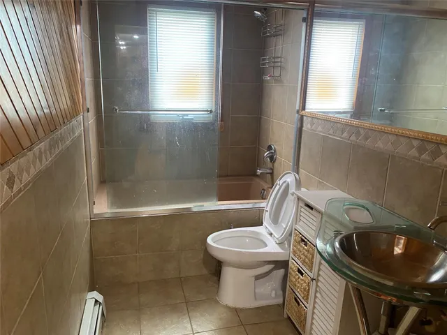 a bathroom with a sink and toilet
