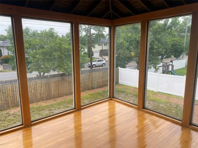 a view of an empty room with a large window
