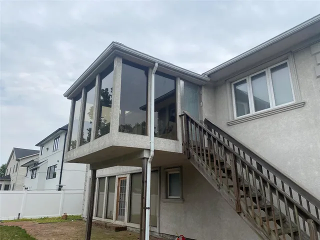 a front view of a house with deck