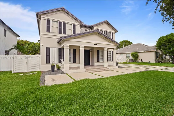 a front view of a house with a yard