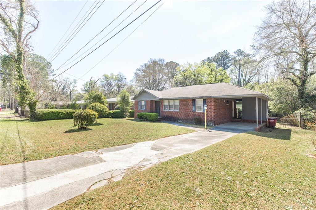 3260 Toole Drive Macon, GA 31204 - Photo 1 of 26 a view of house with outdoor space and swimming pool