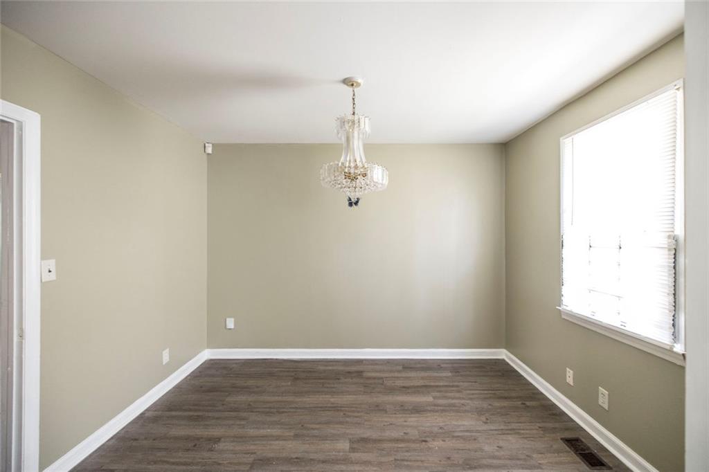 3260 Toole Drive Macon, GA 31204 - Photo 11 of 26 wooden floor in an empty room with a window