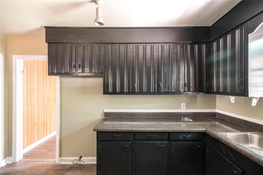 3260 Toole Drive Macon, GA 31204 - Photo 14 of 26 a kitchen with a sink and cabinets