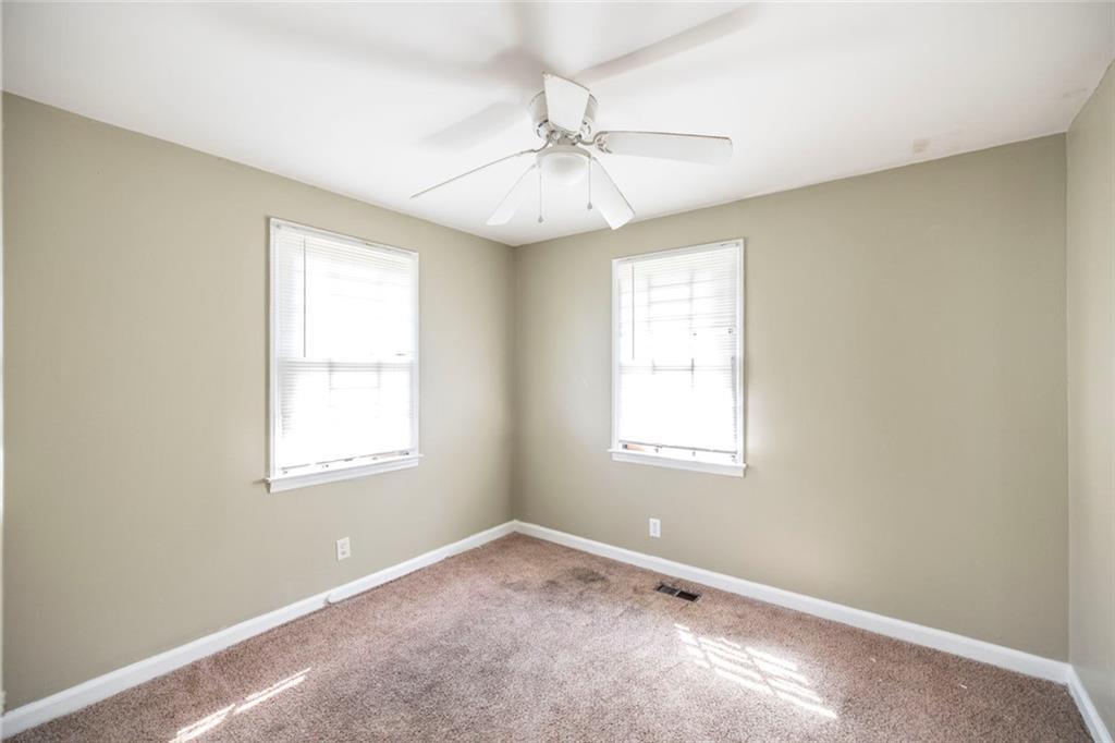 3260 Toole Drive Macon, GA 31204 - Photo 19 of 26 an empty room with a window and a fan