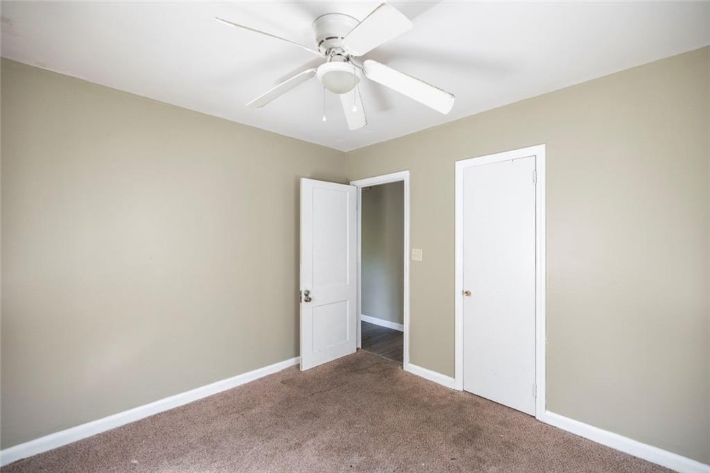 3260 Toole Drive Macon, GA 31204 - Photo 20 of 26 an empty room with a ceiling fan and a fan
