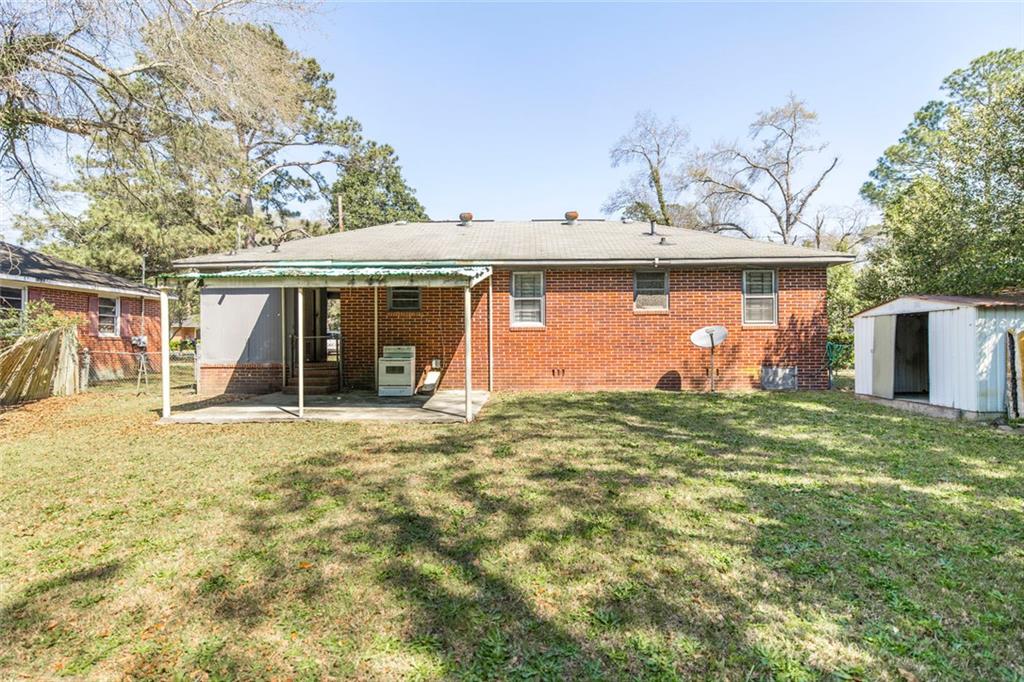 3260 Toole Drive Macon, GA 31204 - Photo 24 of 26 a front view of a house with garden