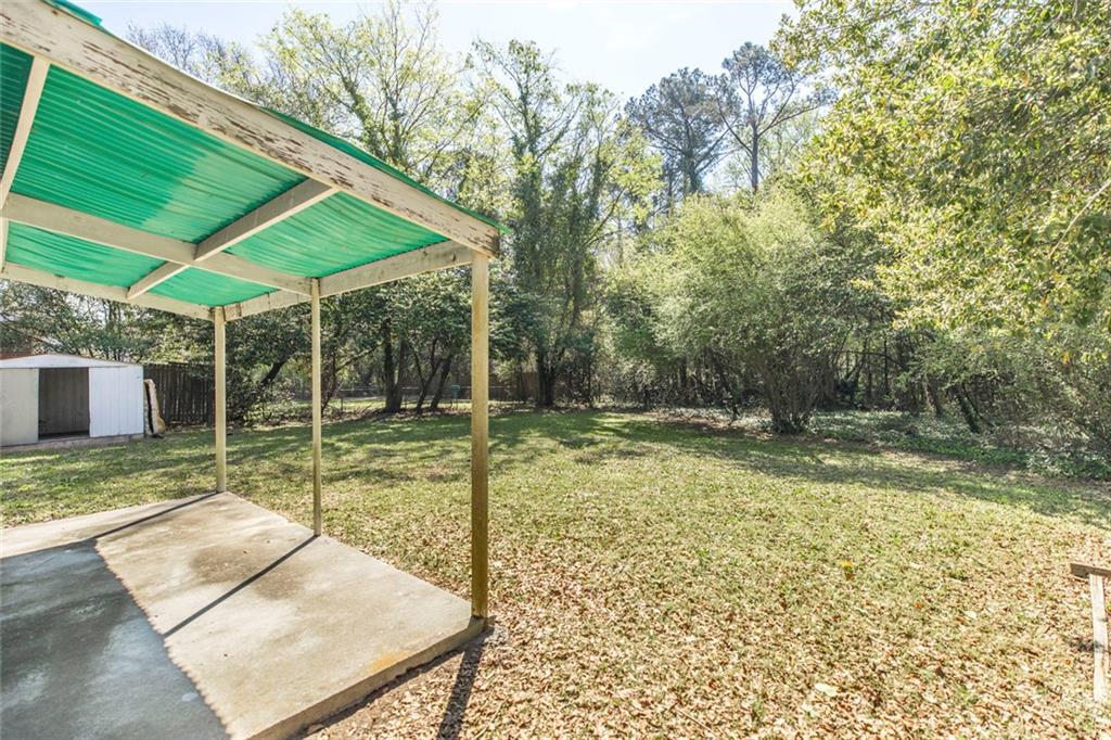 3260 Toole Drive Macon, GA 31204 - Photo 26 of 26 a view of a backyard with a small cabin