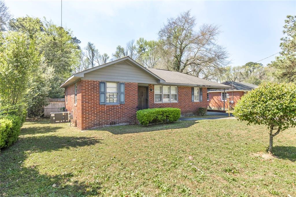 3260 Toole Drive Macon, GA 31204 - Photo 3 of 26 a front view of a house with a yard