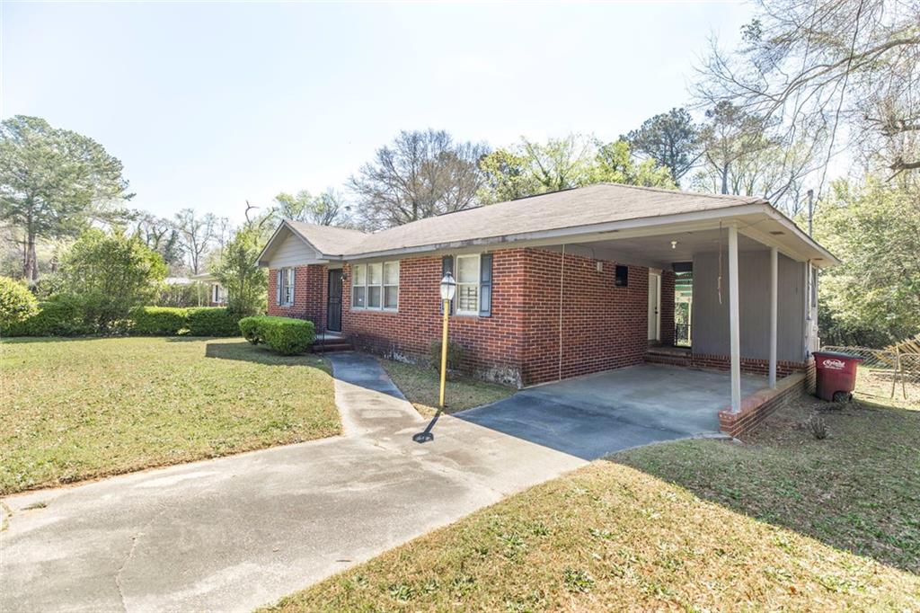 3260 Toole Drive Macon, GA 31204 - Photo 5 of 26 a view of a house with a yard and large tree