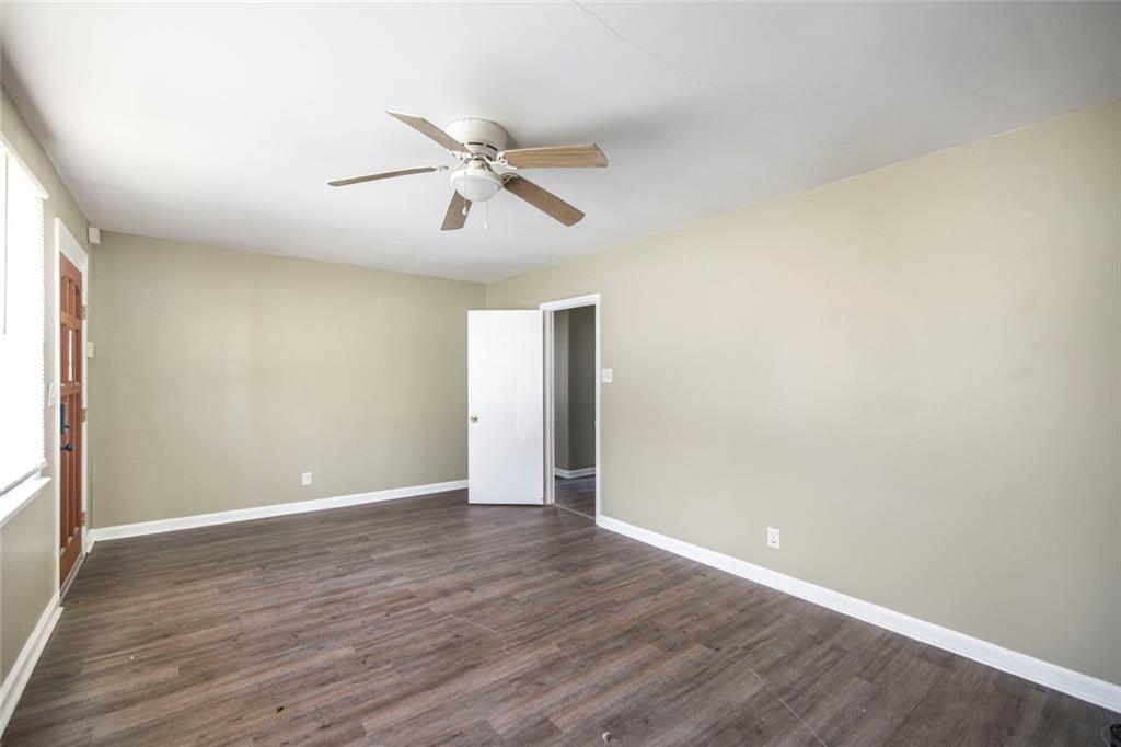 3260 Toole Drive Macon, GA 31204 - Photo 9 of 26 a view of an empty room with wooden floor and a window