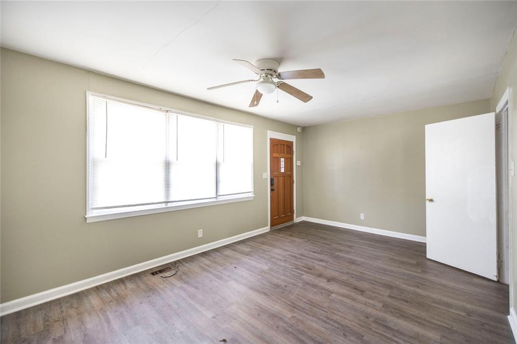 3260 Toole Drive Macon, GA 31204 - Photo 10 of 26 a view of an empty room with wooden floor and a window