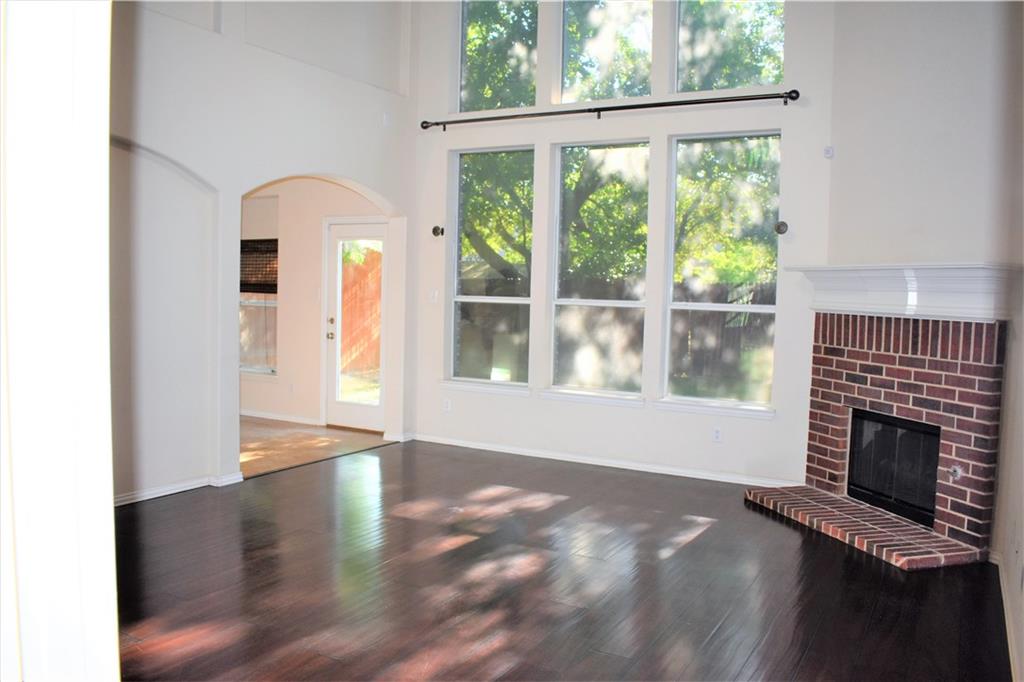 3821 Sandlin Street Grapevine, TX 76092 - Photo 11 of 26 an empty room with windows and fireplace