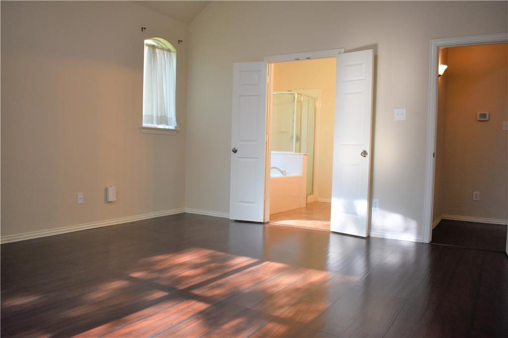 3821 Sandlin Street Grapevine, TX 76092 - Photo 20 of 26 a view of livingroom with wooden floor and front door