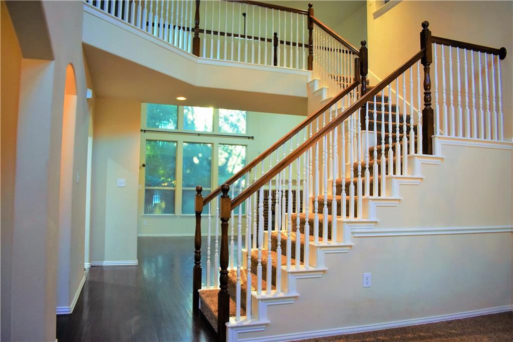 3821 Sandlin Street Grapevine, TX 76092 - Photo 7 of 26 a view of staircase with wooden floor and white walls