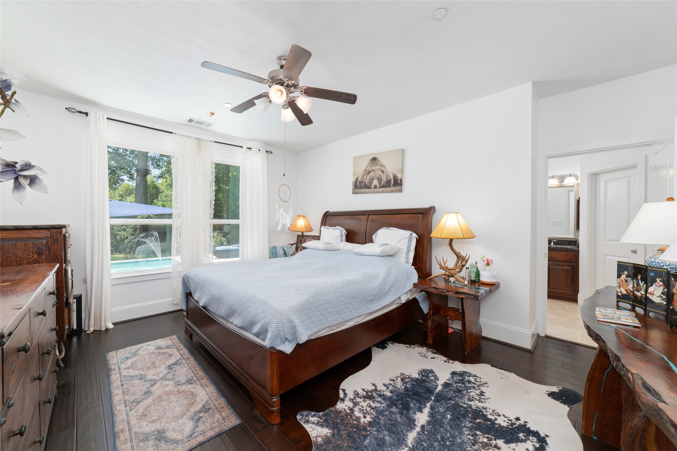 335 Voss Road Houston, TX 77024 - Photo 27 of 45 a bed room with a bed and a tv