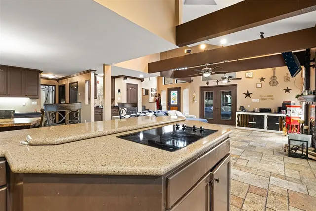 a kitchen with stainless steel appliances granite countertop a sink and cabinets