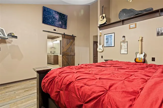 a bedroom with a bed and a dresser