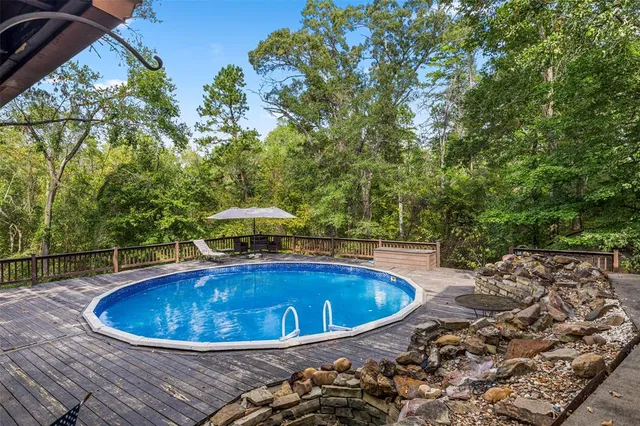 a view of a swimming pool with an outdoor seating