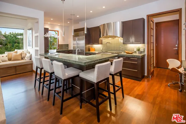 a kitchen with a table and chairs in it