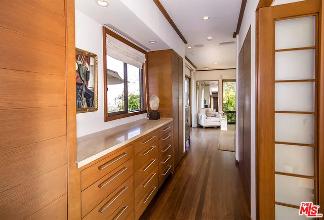 a spacious bathroom with a large mirror and shower