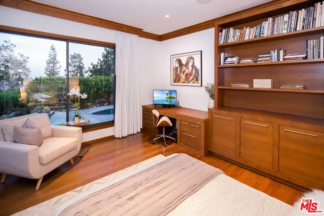 a work room with furniture and a book shelf