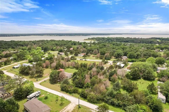 an aerial view of residential building with green space