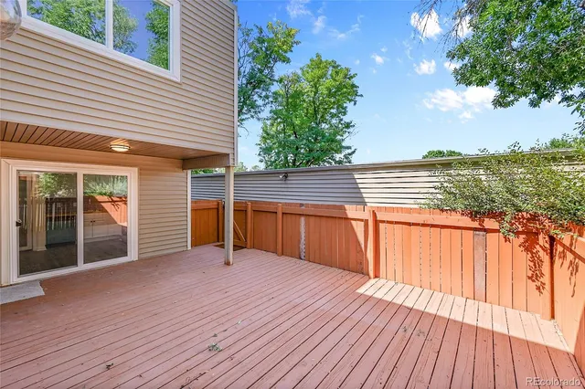 a view of a house with pool and wooden floor