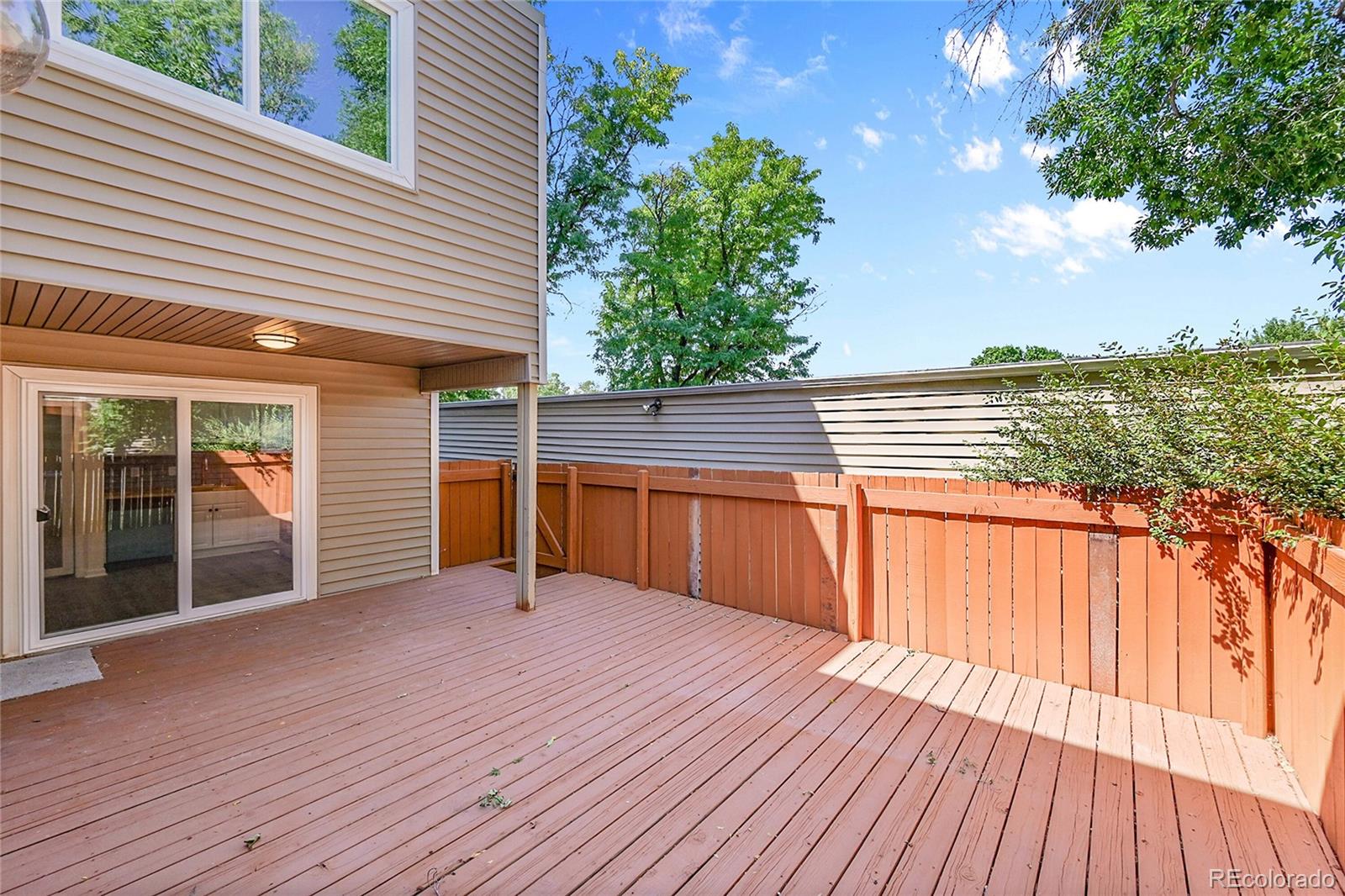 1130 South Clinton Street, Unit 68 Denver, CO 80247 - Photo 16 of 18 a view of a house with pool and wooden floor