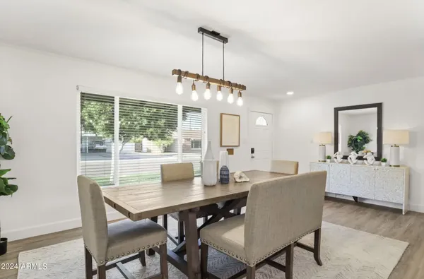 a view of a dining room with furniture window and outside view