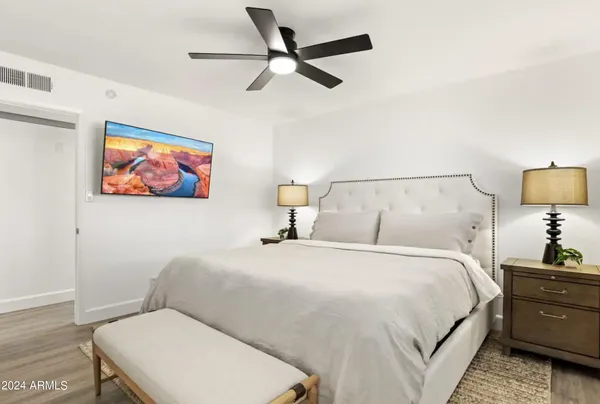 a bedroom with a bed and dresser