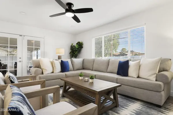 a living room with furniture and a large window