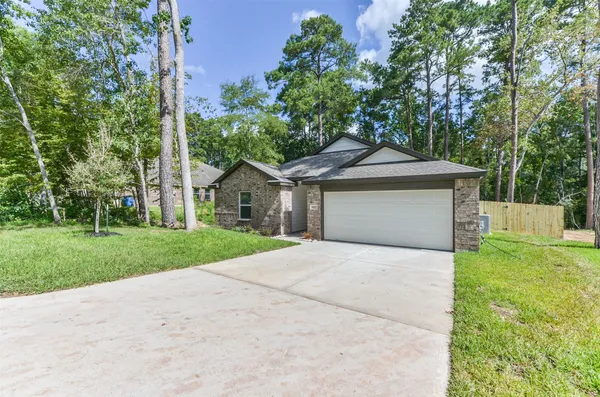 a front view of a house with yard