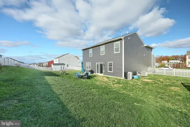 a view of an chairs and table in the garden