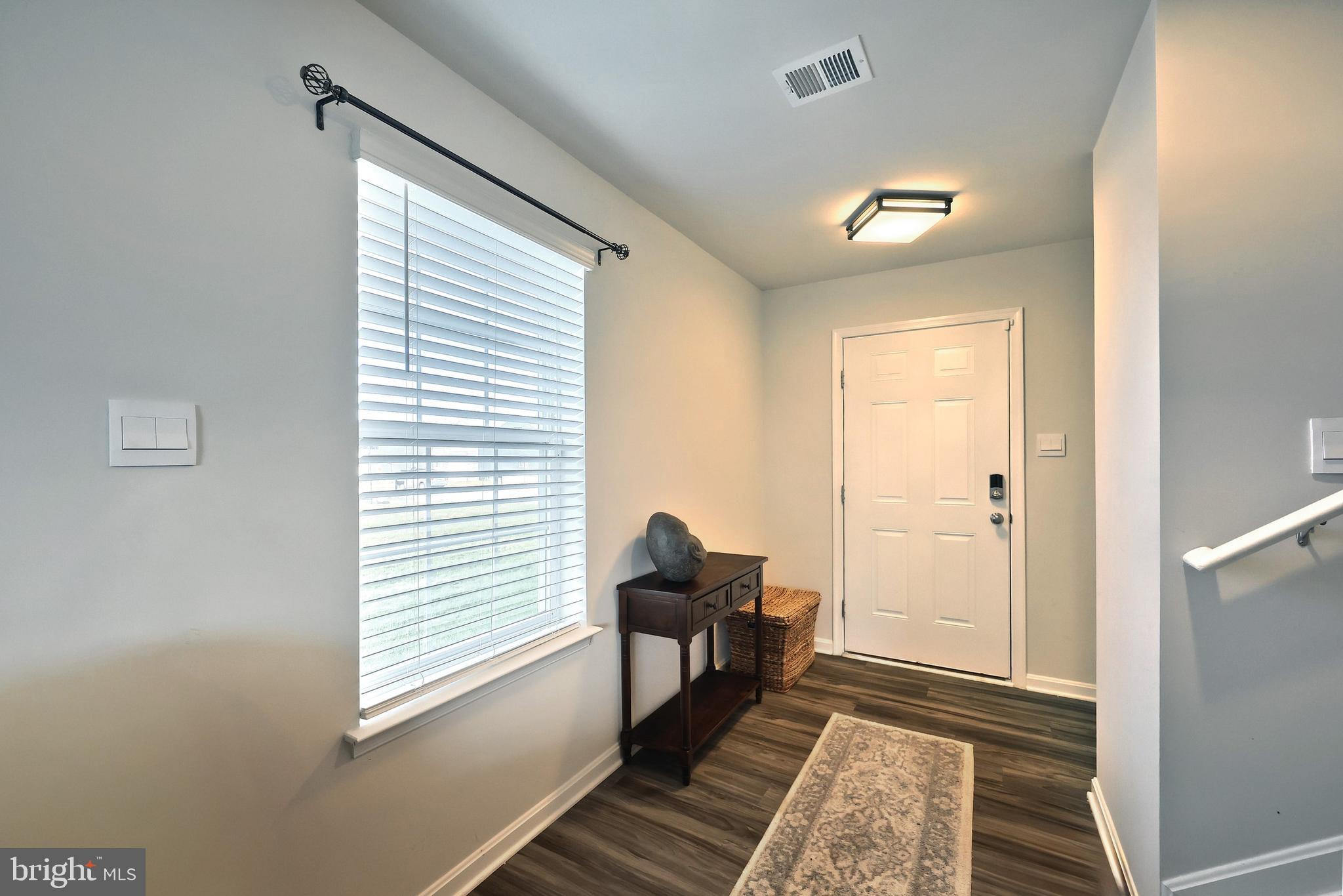 90 Knobby Hook Drive Hanover, PA 17331 - Photo 17 of 48 a hallway with wooden floor windows and entryway