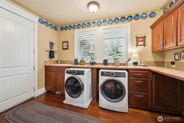 a bathroom with a granite countertop sink mirror and a shower