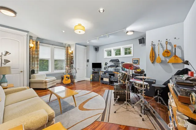 a view of a dining room with furniture window and wooden floor