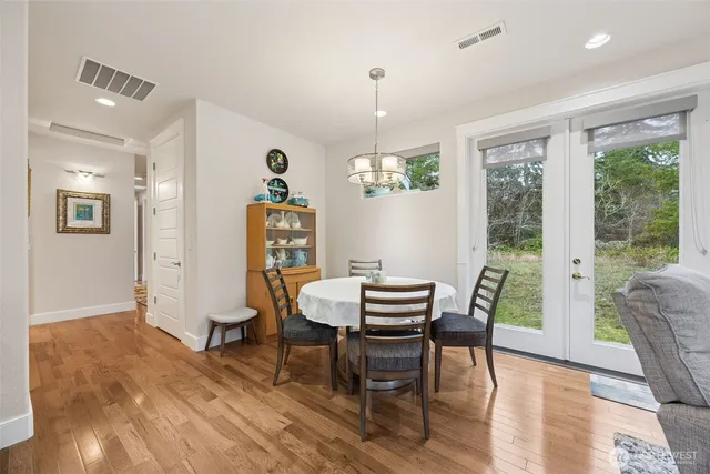 a living room with furniture a rug and a chandelier