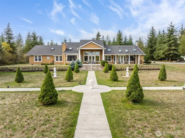 an aerial view of a house with swimming pool