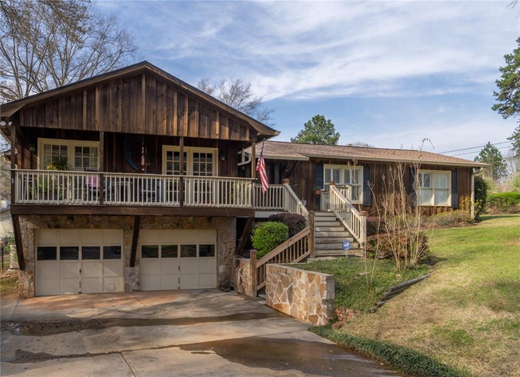 113 Admiralty Way Northwest Milledgeville, GA 31061 - Photo 1 of 1 a front view of a house with garden