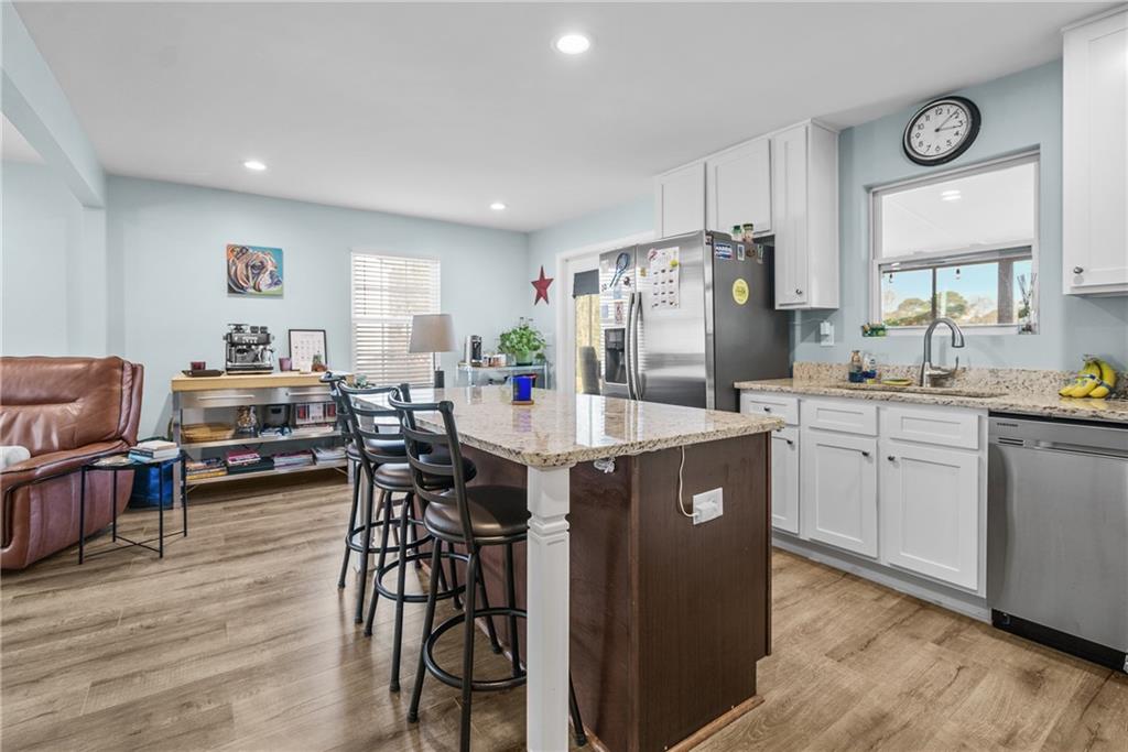2444 Constance Street Atlanta, GA 30344 - Photo 13 of 39 a kitchen with a sink refrigerator and cabinets